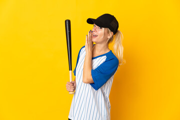 Young Russian woman isolated on yellow background playing baseball and whispering something