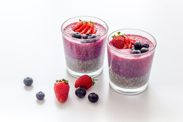 Homemade yogurt chia seeds pudding with strawberries in glasses