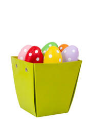 Multicolored easter eggs decorated dots in basket isolated on the white background