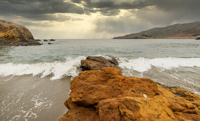 Rock formations against the backdrop of the ocean in the San Francisco Recreation Area, Rodeo Beach, California, USA. Seaside, beautiful landscape, California coast.
