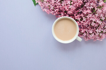 Obraz na płótnie Canvas blue spring flowers lilac, cup of coffee with milk, place for text, spring texture