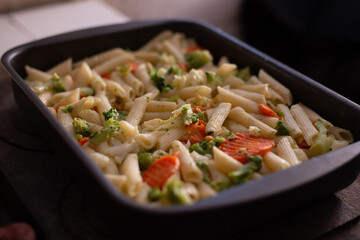preparation of pasta with vegetables in the pan. healthy vegan food
