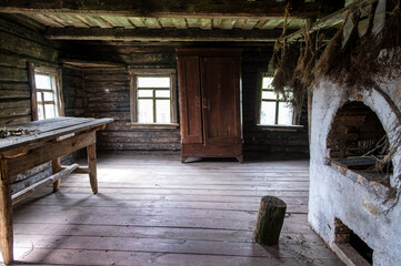 Fototapeta na wymiar Interior of wooden countryside old house with rustic oven