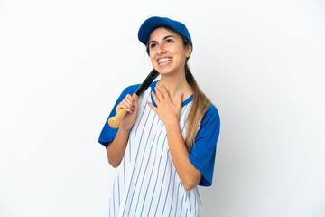 Young caucasian woman playing baseball isolated on white background looking up while smiling