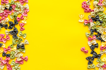 Frame of pasta - flay lay of Italian colorful farfalle, top view