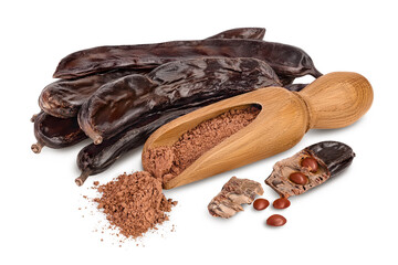 Carob pod and powder in wooden scoop isolated on white background with clipping path and full depth of field.