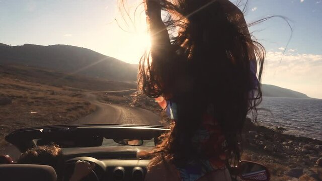 Sporty girl standing in cabriolet