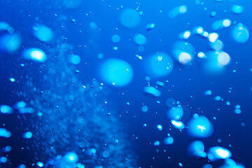 Water bubbles details texture over deep blue background