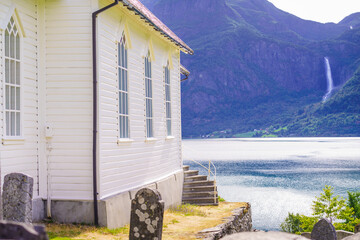 Wooden church in Nes village at fjord, Norway