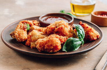 Popular Baked Cauliflower with barbeque sauce. Buffalo barbecue Cauliflower Wings. Vegan Food concept.