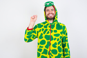 Naklejka premium young caucasian man wearing a pajama standing against white background pointing up with fingers number ten in Chinese sign language Shi