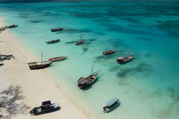 Zanzibar, a fishing village on the exotic coast. Boats drift peacefully in the bay 