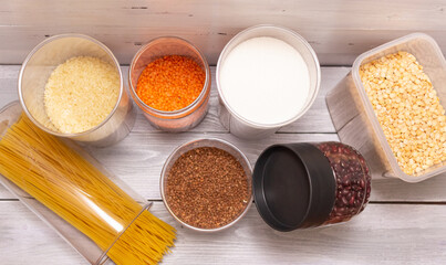 Zero-waste storeroom. Breakfast items, preserved in a resealable plastic jars, cereals, pasta. Banks can be filled several times with bulk products. Plastic.