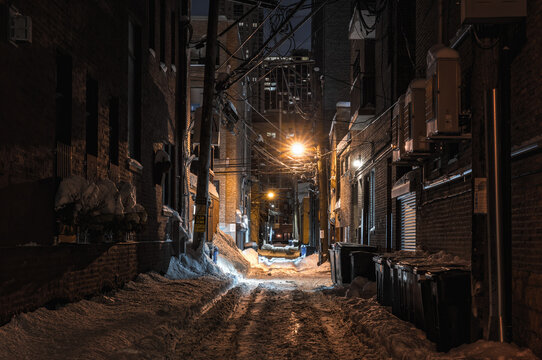 snow covered alley in the night