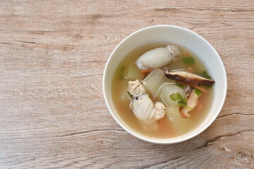 boiled winter melon with squid stuffed mashed pork soup in bowl on table