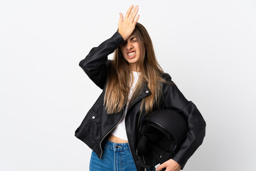 Young Woman holding a motorcycle helmet over isolated white background having doubts with confuse face expression