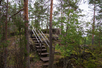 wooden stairs along the rocks