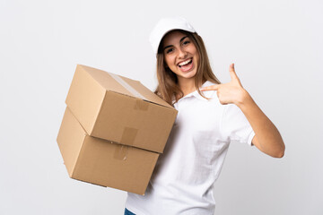 Young delivery woman over isolated white background proud and self-satisfied