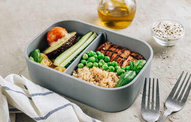 Healthy lunch in plastic containers with quinoa and chicken.