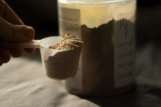 a scoop of chocolate whey protein
