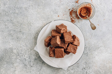 Raw vegan chocolate fudge. Healthy vegan food concept.