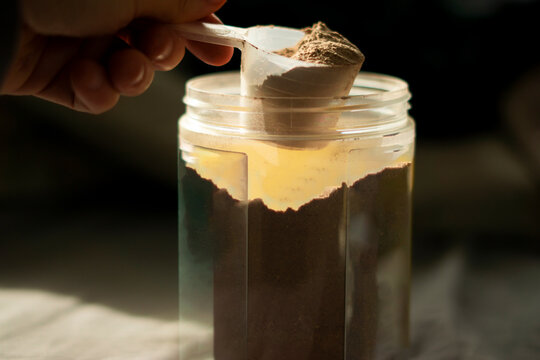 a scoop of chocolate whey protein