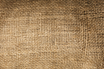 Natural brown linen fabric background. Fiber structure texture. Vintage canvas pattern. Rustic decoration pattern. Antique hessian bag textile background.