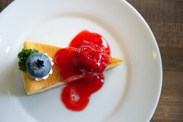 Strawberry cheesecake placed in a white plate.