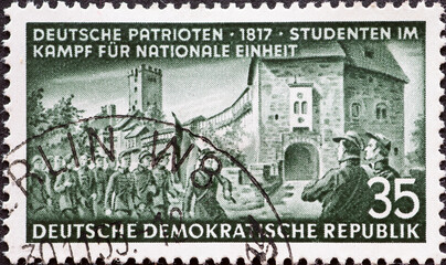 GERMANY, DDR - CIRCA 1953 : a postage stamp from Germany, GDR showing the student demonstration at the Wartburg 1817 Text: German patriots - obrazy, fototapety, plakaty
