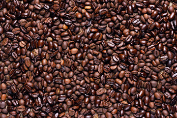 Roasted Ccoffee beans background. Arabic roasting coffee. Ingredient of hot beverage.