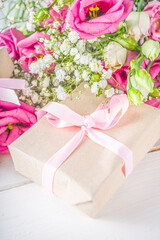 Fototapeta na wymiar Beautiful spring flowers with gifts