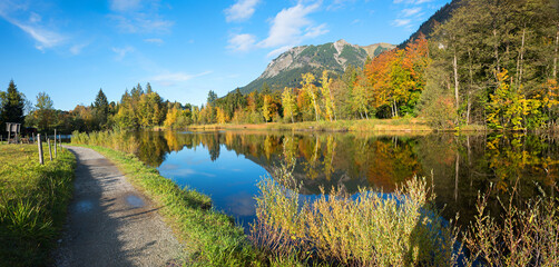 idyllic autumnal landscape Moorweiher Oberstdorf, sunny day in october