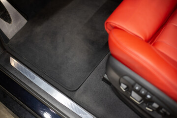 Car detailing series: interior of a luxury car. red seats