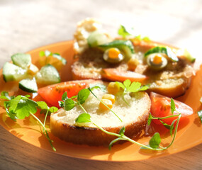 Plate with creative and simple breakfast  for children on table. Fun food art for kids. Morning light and shadow
