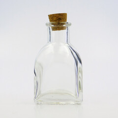 medium glass bottle with cork cap rectangle form, transparent, sparkly and brilliant, for food, liquids, sauces, grain, condiments, seeds, preserves and candys, also for decoration