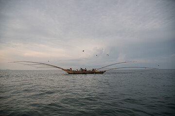 Fishermen in a typical boat in Lake Kivu, Rwanda,