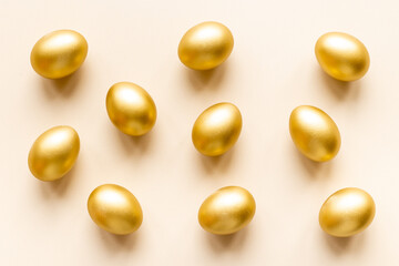 Golden eggs flat lay. Save money. Wealth and good luck symbol
