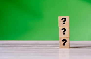 Quiz concept symbol with question mark on wooden cube blocks. Support or questionnaire background pattern