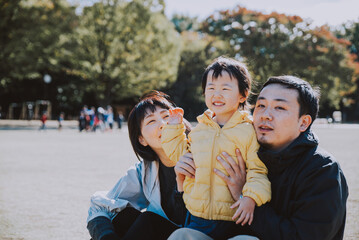 Happy japanese family spending time outdoor