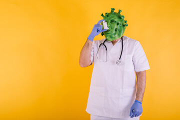 Doctor - nurse disguised as coronavirus wearing latex mask - covid-19 virus taking an asthma...