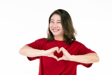 Portrait of middle age 40s Asian woman Use your hands to make a heart shape and smile happily.