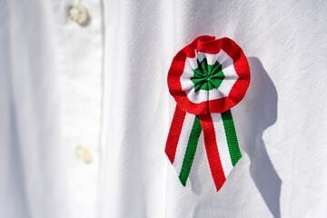 close up white shirt with tricolor rosette symbol of the hungarian national day 15th of march