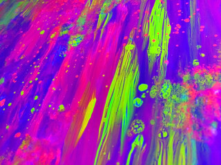 Abstract watercolor neon background yellow purple pink spray stains paint ultraviolet light free space for text defocus