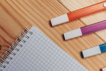 multicolored markers work desk close-up wooden background office