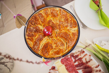 Traditional handmade holiday bread, food serving on table,  Eastern orthodox Easter day at home.