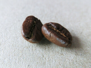 Two roasted coffee beans close up