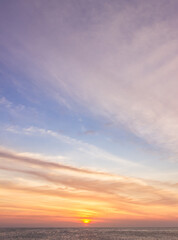 sunset vertical over the sea in the evening with colorful sunlight.