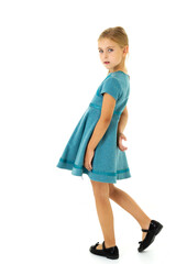 Cute blonde girl in stylish blue dress