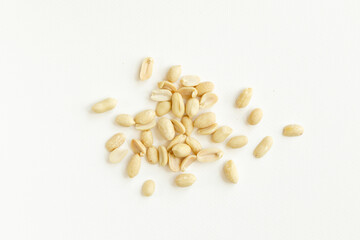 Group of peeled peanuts isolated on a white background.
