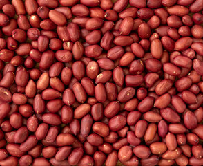 Top view of peeled peanuts as background, texture.